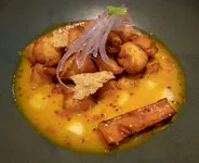 Fried fish in a spicy lime dressing with grilled sweet potato and choclo