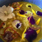 Confit duck with edible flowers