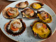 Scallops three ways, "aztec" (with jalapeno), "reggiana" (with parmesan), "griego" with yellow chile sauce