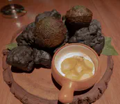 Coca Bread stuffed with spicy pork, mashua pickle.