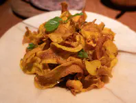Goat curry with crispy olluco, coriander
