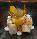 Cherimoya "white fish", meringues, sweet potato crisp, liquid nitrogen mandarin sac "shrim", and sweetened lime sauce "leche de tigre"