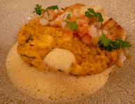 Roasted grouper with creamy shrimp and bull crab rice, salsa, and crab coral foam.