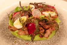 Sauteed Pedro Ximénez glazed sweetbreads on a bed of mushy peas. With black truffle butter amd hard cooked quail egg .